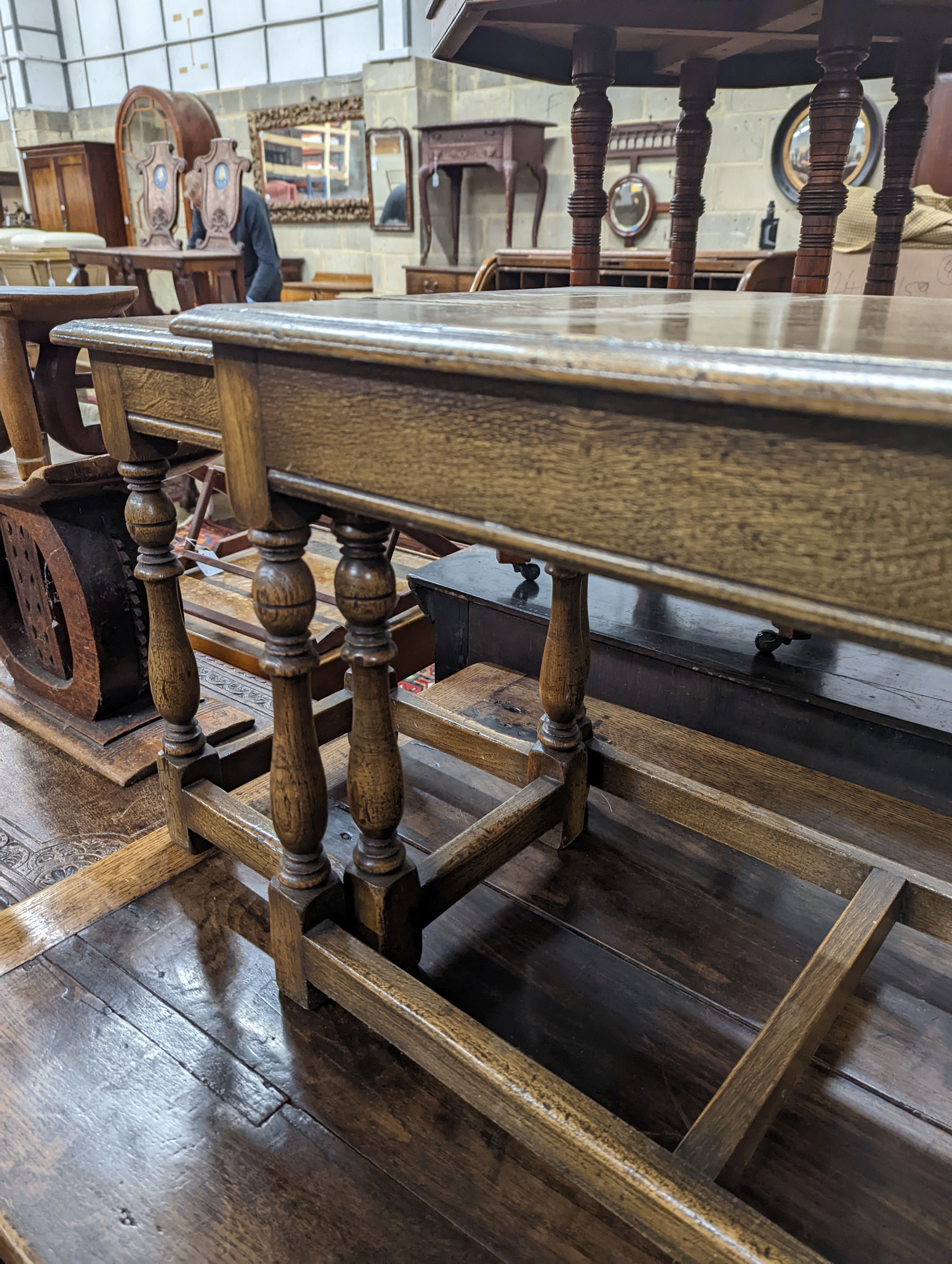 A nest of 18th century oak occasional tables, width 101cm, depth 38cm, height 46cm